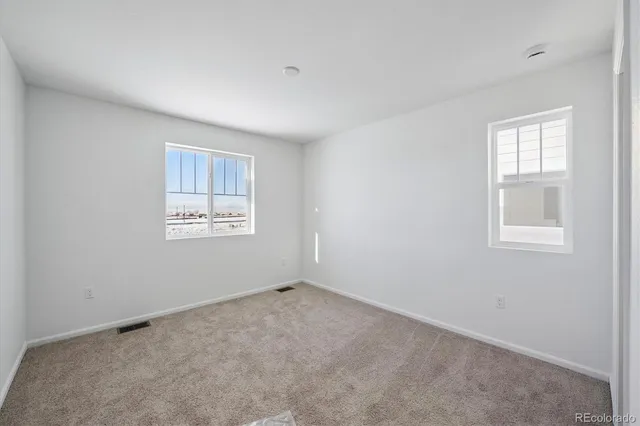 an empty room with windows