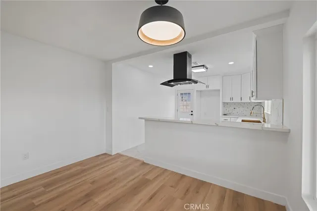 a view of a kitchen with a sink