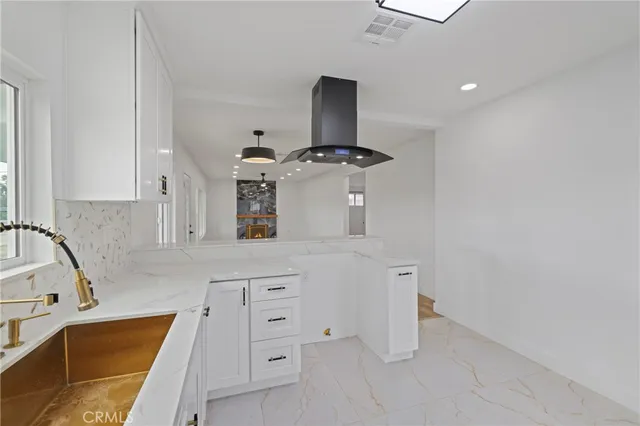 a kitchen with stainless steel appliances cabinets and a sink
