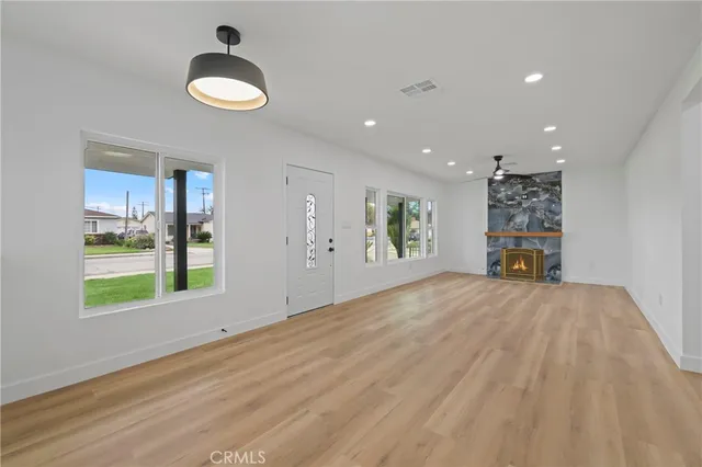 a view of an empty room and a window