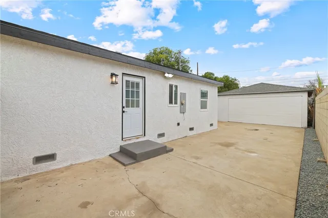 a view of a house with a backyard space