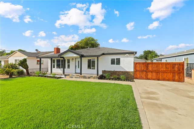 a front view of a house with yard porch and patio