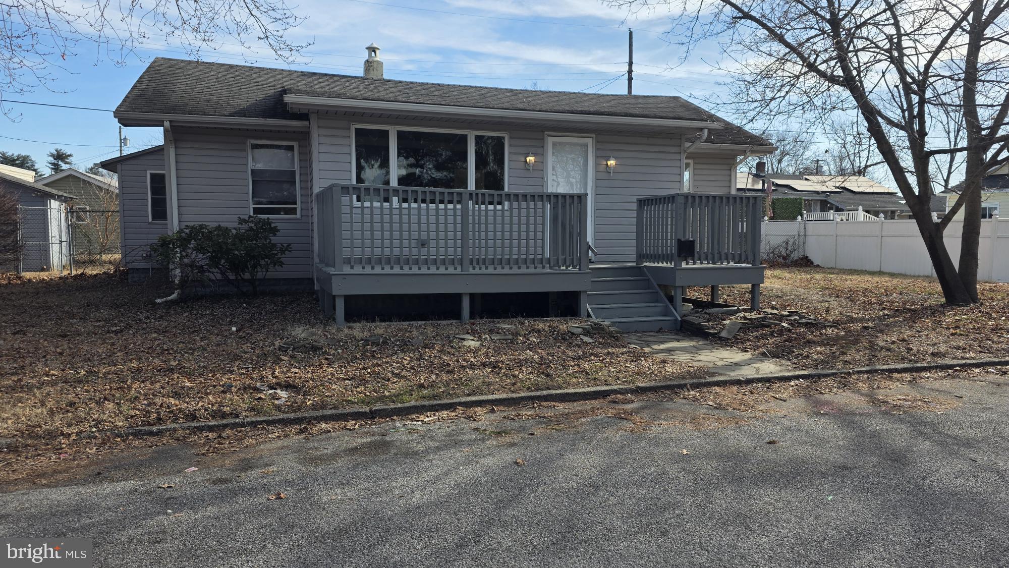 239 J Street Carneys Point, NJ 08069 - Photo 1 of 19 a front view of a house with garden