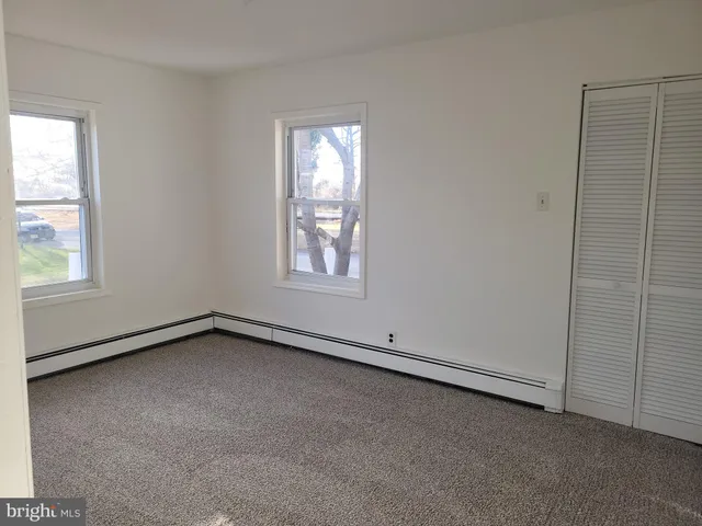 an empty room with windows