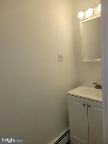 a bathroom with a sink and vanity