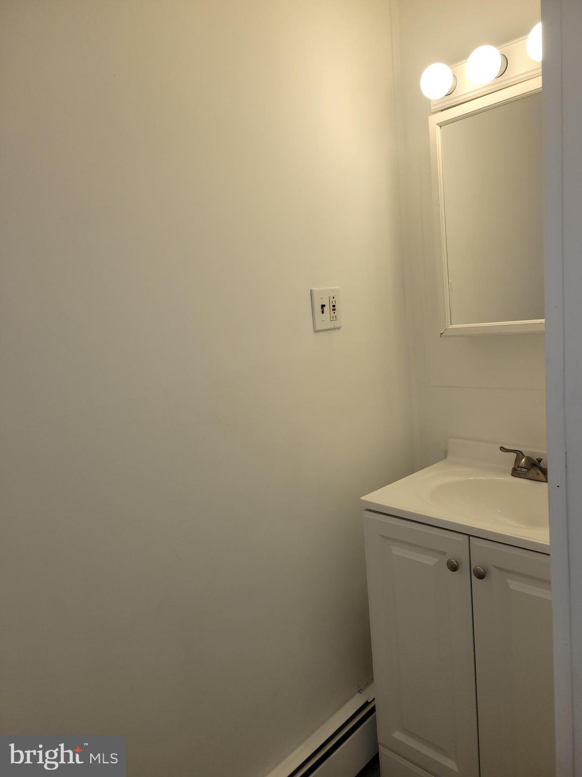 239 J Street Carneys Point, NJ 08069 - Photo 16 of 19 a bathroom with a sink and vanity