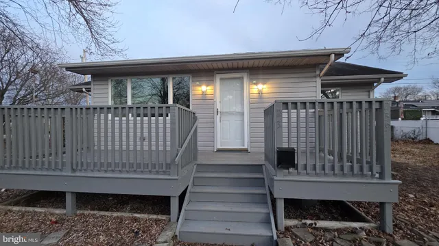 a view of entryway with wooden stairs