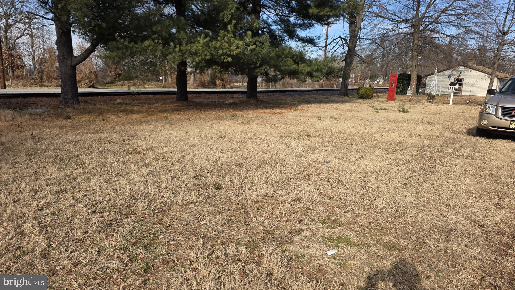 239 J Street Carneys Point, NJ 08069 - Photo 5 of 19 a view of street with trees