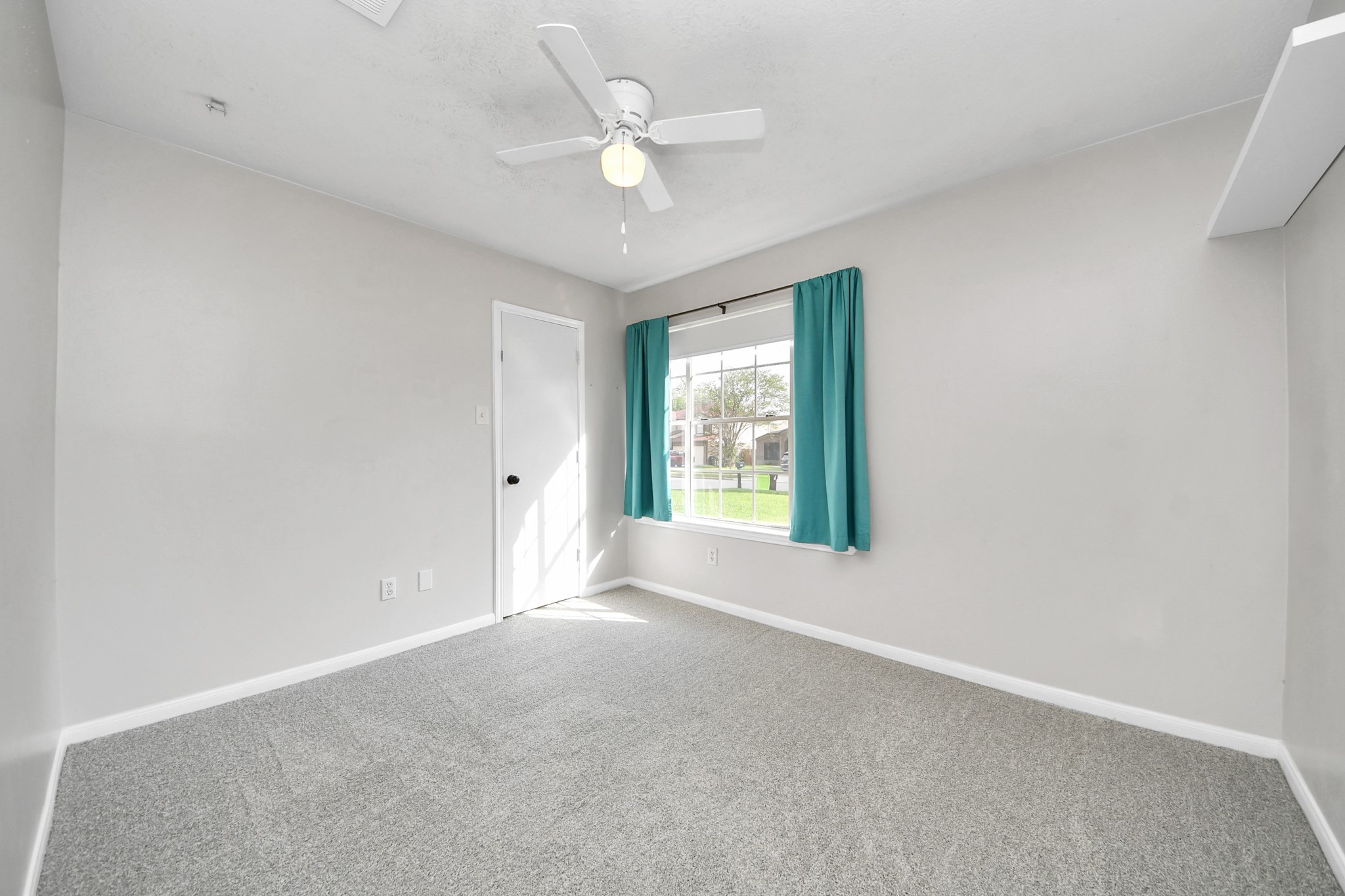28707 Stapleford Street Spring, TX 77386 - Photo 25 of 38 an empty room with windows and ceiling fan