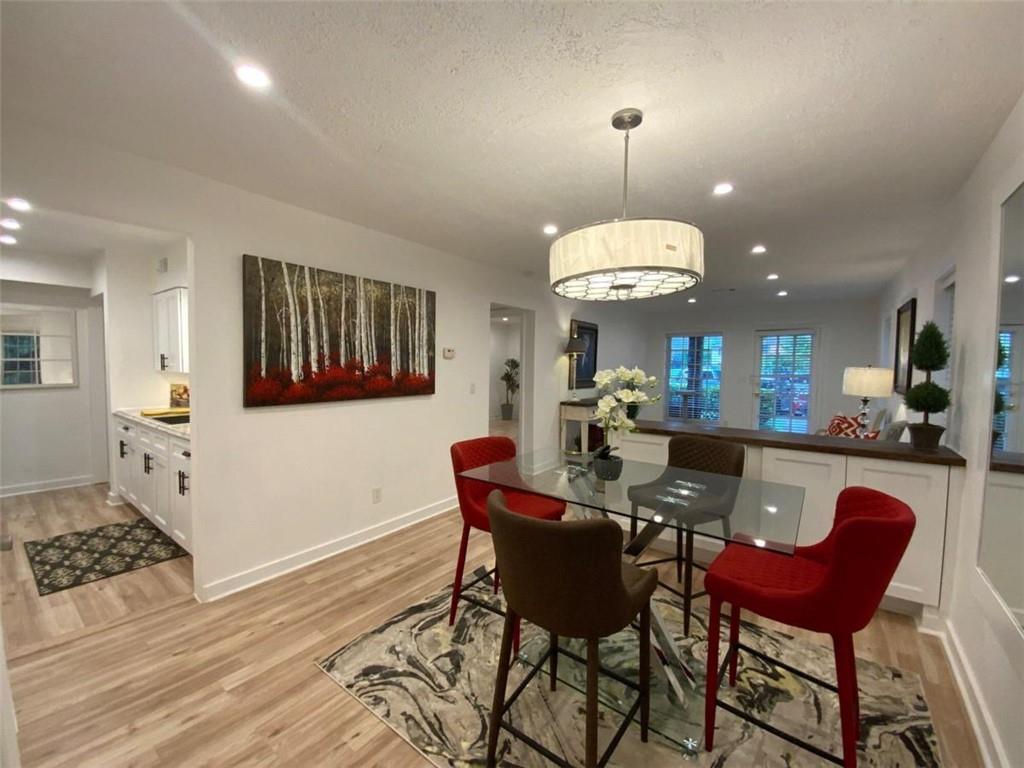 3091 Colonial Way, Unit P2 Atlanta, GA 30341 - Photo 1 of 1 a view of a dining room with furniture and chandelier