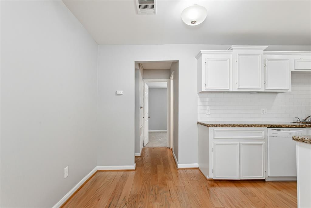 4931 Junius Street, Unit 8 Dallas, TX 75214 - Photo 12 of 31 a view of kitchen with wooden floor and electronic appliances