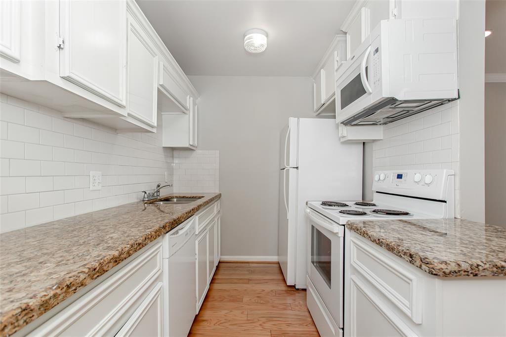 4931 Junius Street, Unit 8 Dallas, TX 75214 - Photo 14 of 31 a kitchen with stainless steel appliances granite countertop a stove and a sink