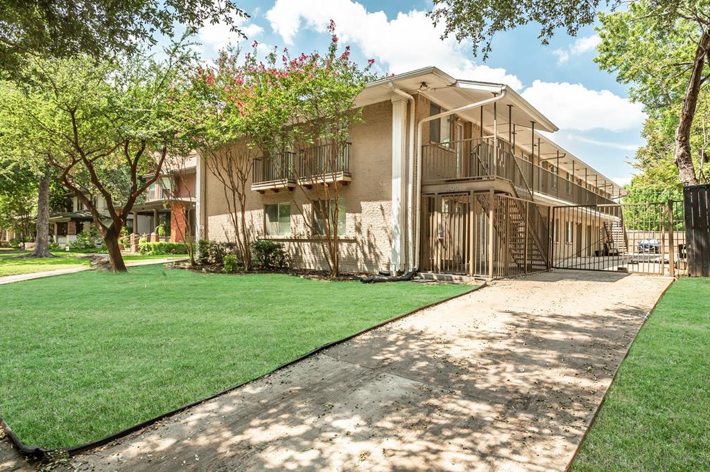 4931 Junius Street, Unit 8 Dallas, TX 75214 - Photo 29 of 31 a view of a house with a yard