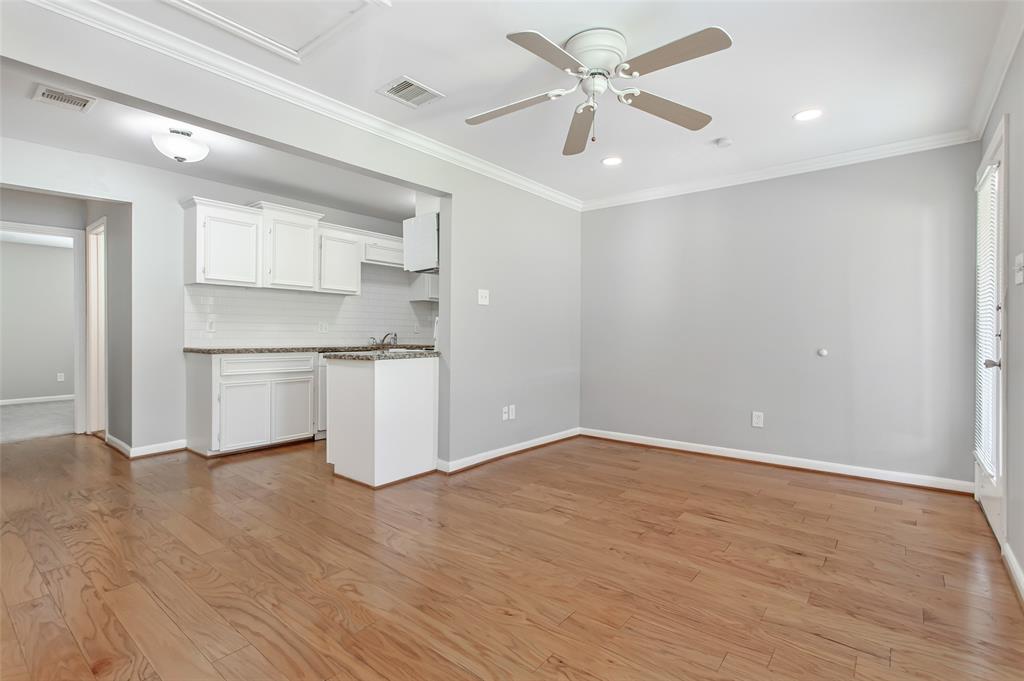 4931 Junius Street, Unit 8 Dallas, TX 75214 - Photo 5 of 31 a view of a kitchen with a sink and a window