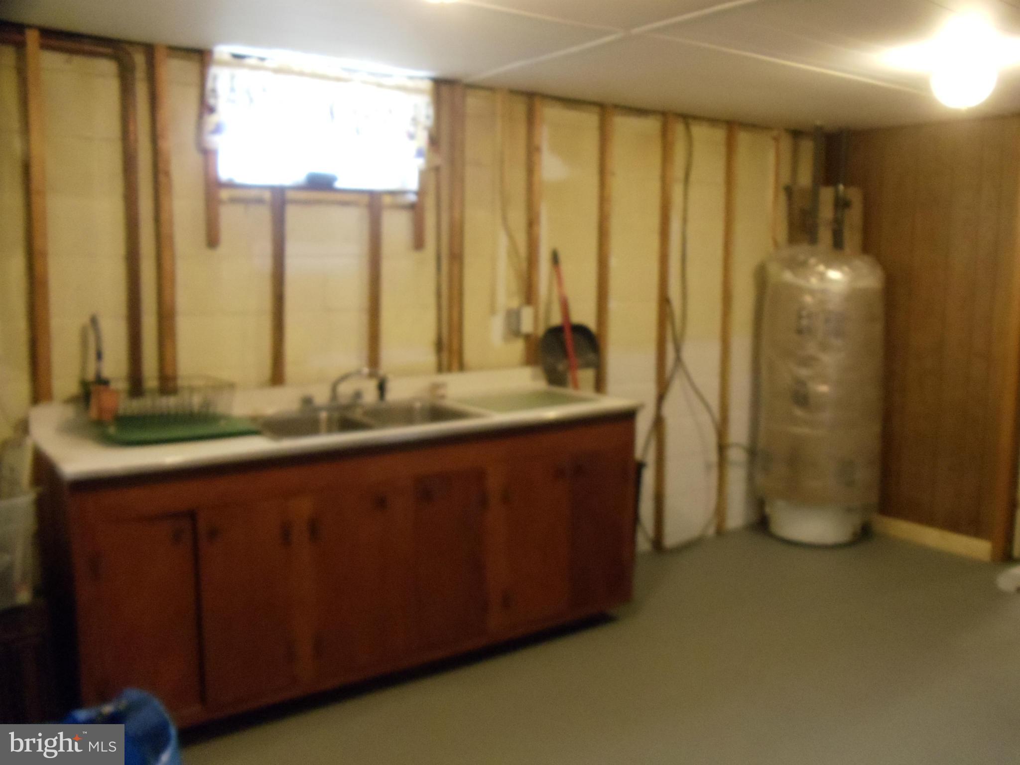 8222 Highpoint Road Clearwater Beach, MD 21226 - Photo 14 of 22 Basement offers in-law possibilities w/kitchenette