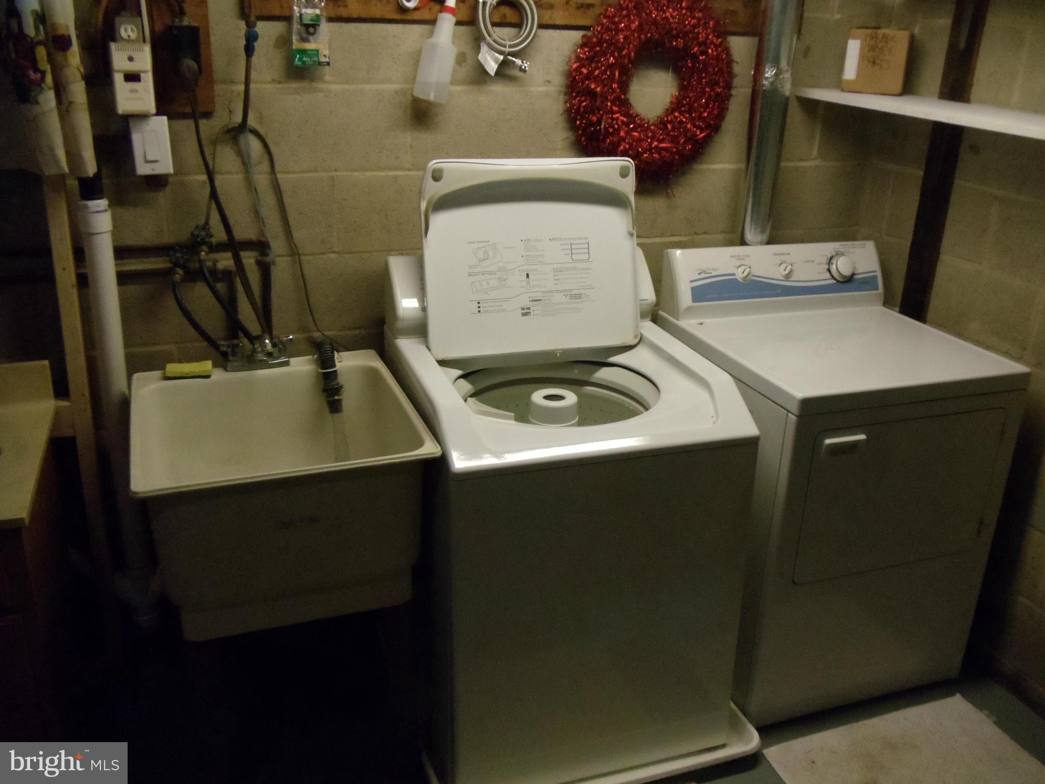 8222 Highpoint Road Clearwater Beach, MD 21226 - Photo 15 of 22 Washer, dryer & utility tub in basement