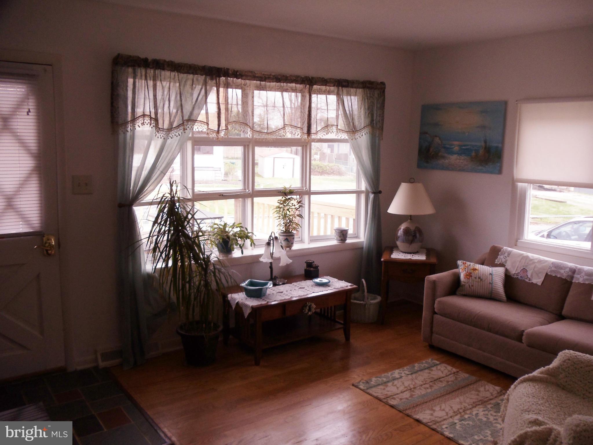 8222 Highpoint Road Clearwater Beach, MD 21226 - Photo 3 of 22 Liv Rm offers bright bay window