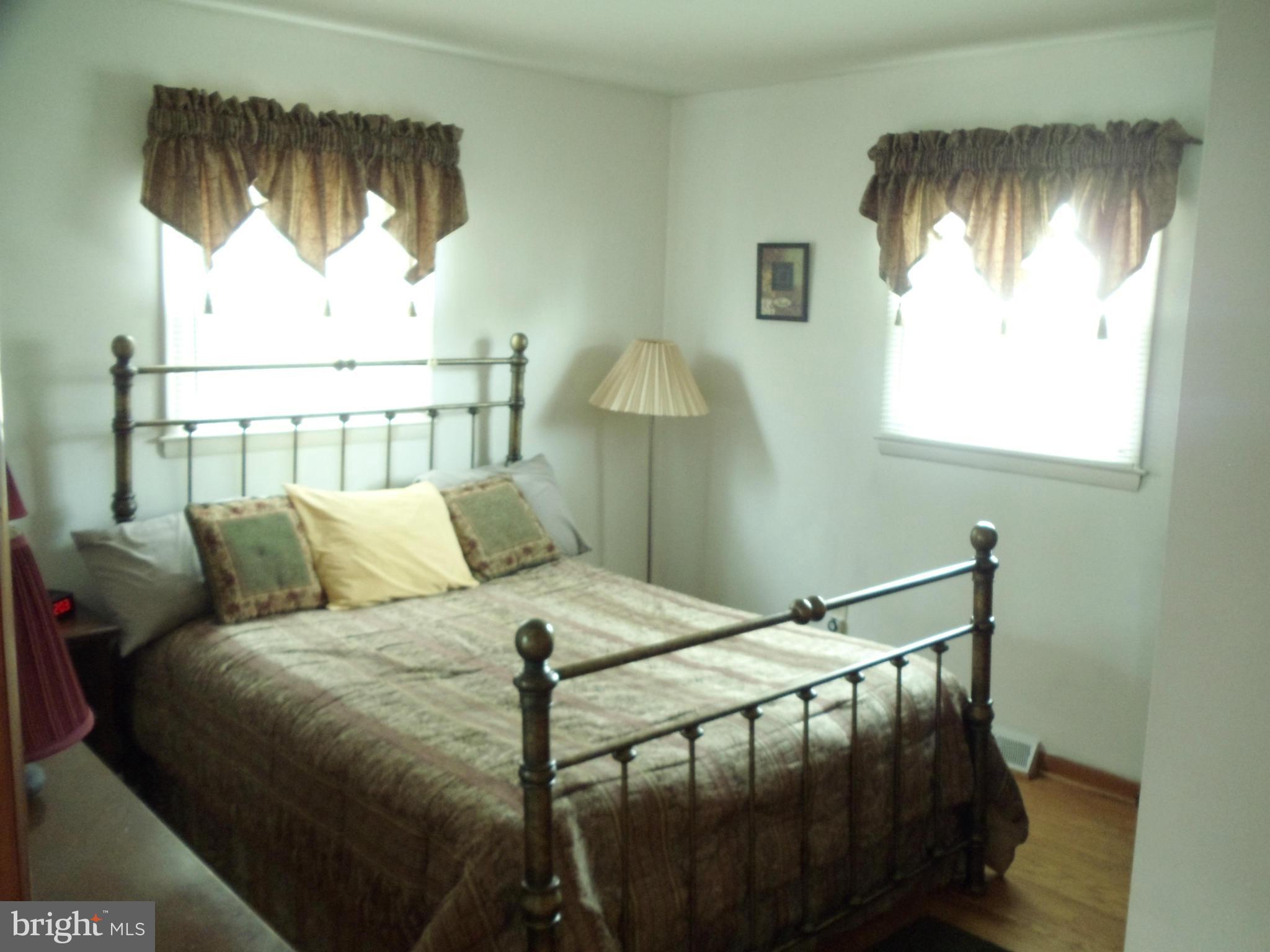 8222 Highpoint Road Clearwater Beach, MD 21226 - Photo 5 of 22 Master bright & sunny w/hardwood