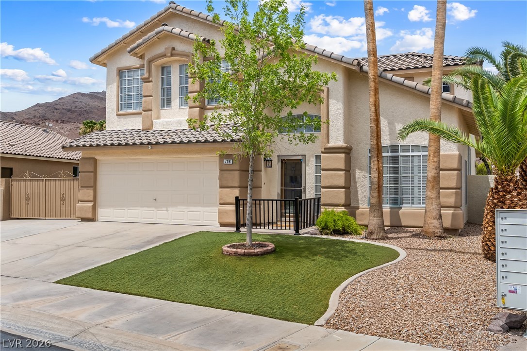 708 Vortex Avenue Henderson, NV 89002 - Photo 71 of 71 A well-maintained facade with synthetic turf and desert landscaping offers attractive curb appeal.