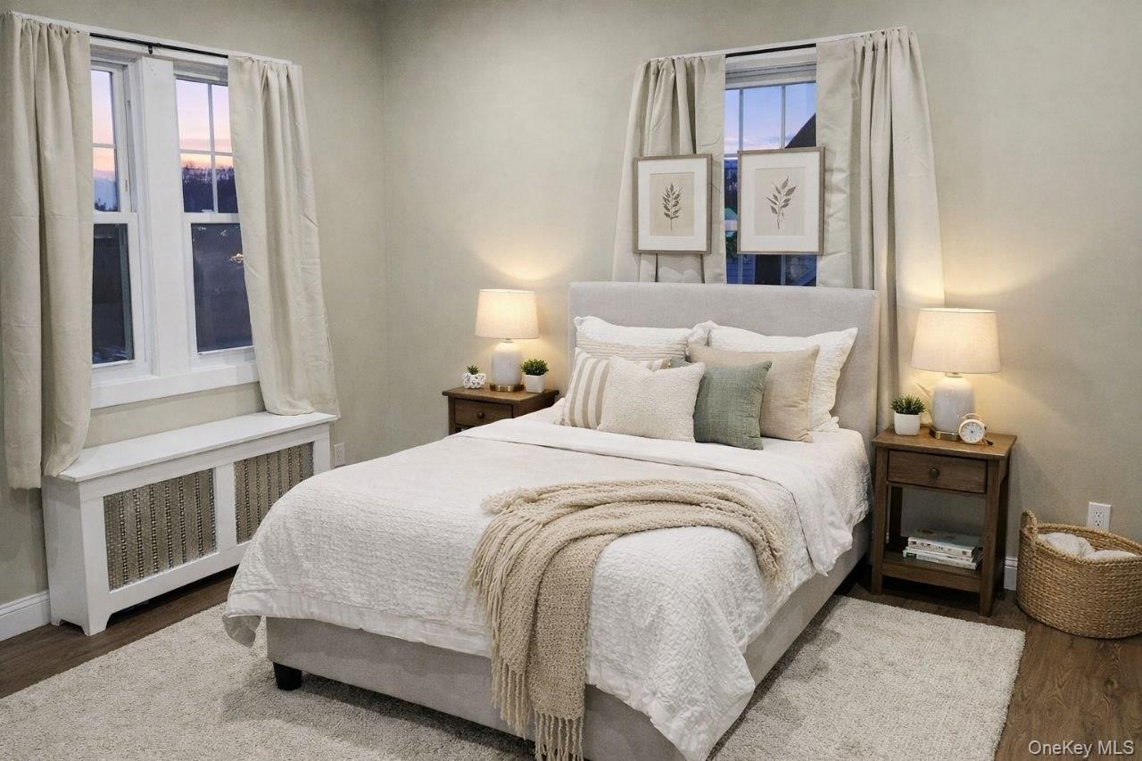 25 Allard Avenue New Rochelle, NY 10805 - Photo 5 of 8 a bedroom with a bed and window