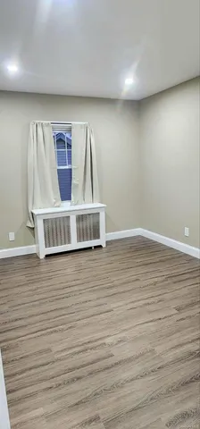 a view of a livingroom with wooden floor