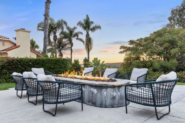 a large kitchen with a table and chairs
