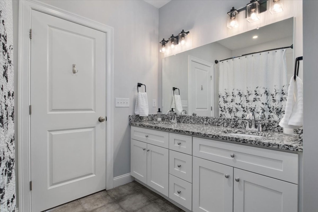 9 Iris Lane Bellingham, MA 02019 - Photo 21 of 34 a bathroom with a granite countertop sink and a mirror