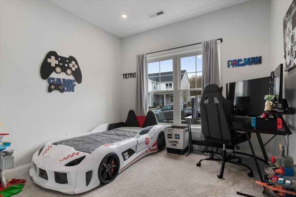 9 Iris Lane Bellingham, MA 02019 - Photo 26 of 34 a bedroom with a bed and a desk