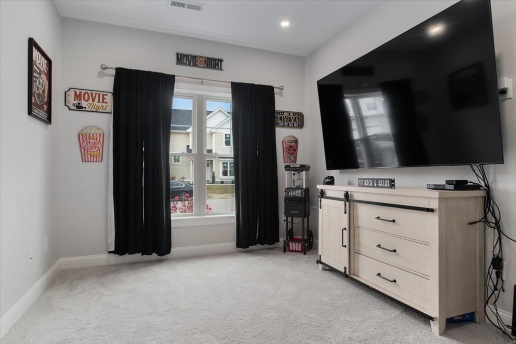 9 Iris Lane Bellingham, MA 02019 - Photo 27 of 34 a view of an empty room with cabinet and flat screen tv