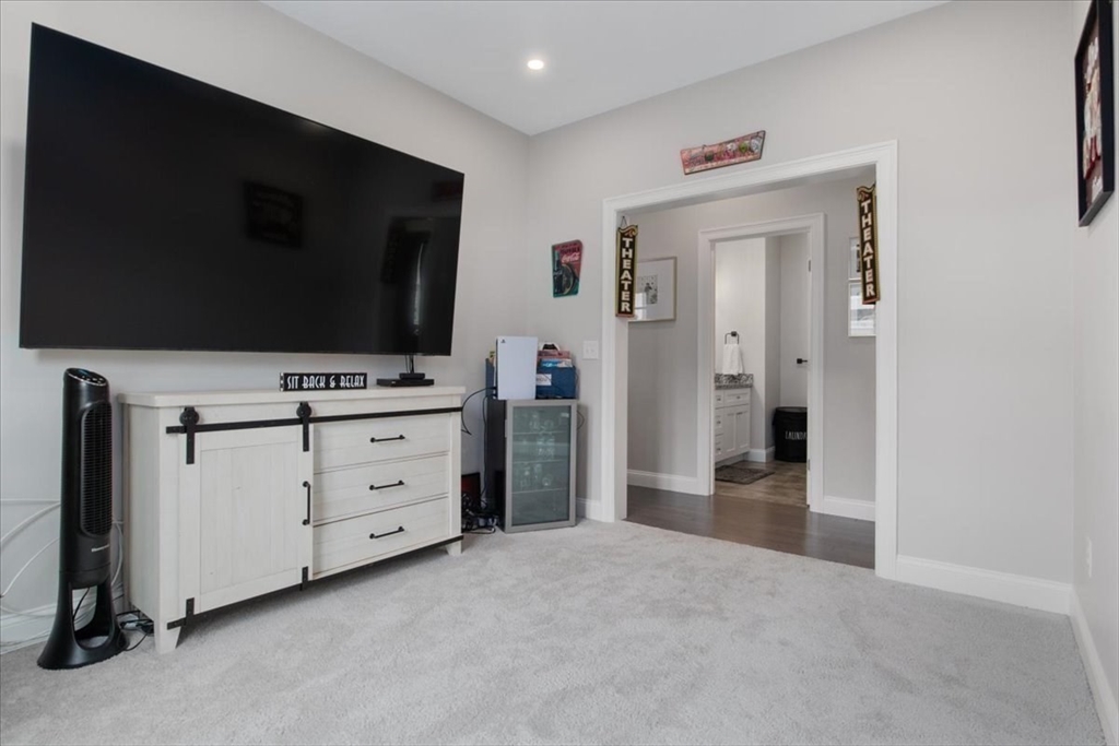 9 Iris Lane Bellingham, MA 02019 - Photo 28 of 34 a view of room with flat screen tv