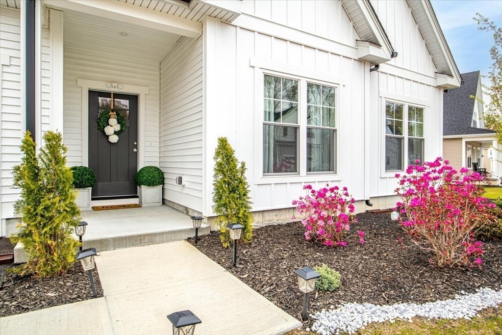 9 Iris Lane Bellingham, MA 02019 - Photo 3 of 34 a front view of a house with yard