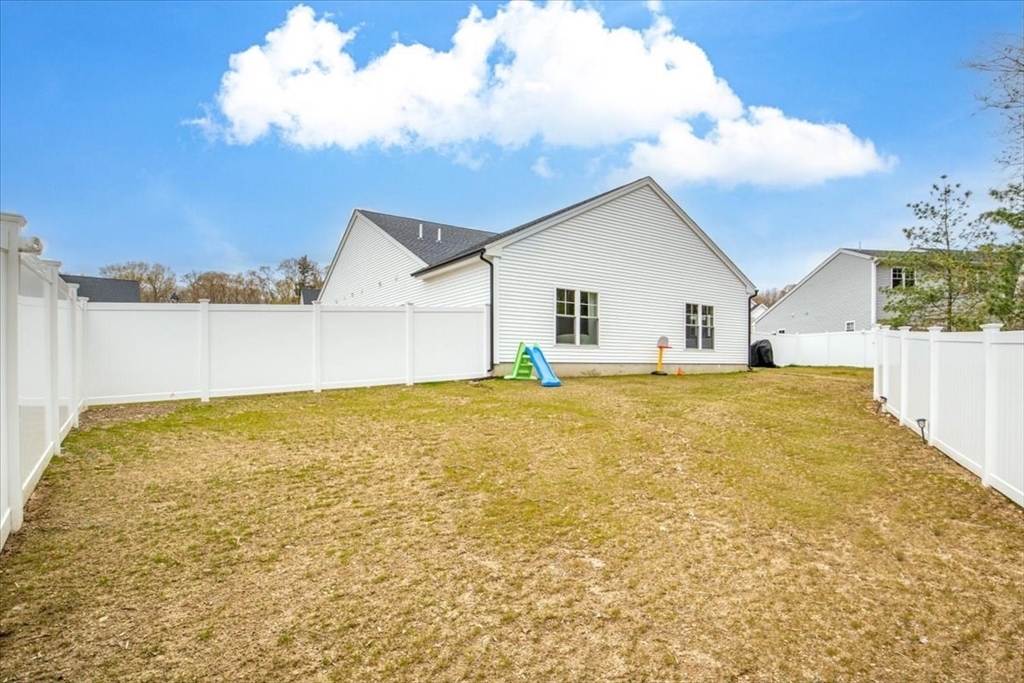 9 Iris Lane Bellingham, MA 02019 - Photo 32 of 34 a house view with swimming pool in front of it