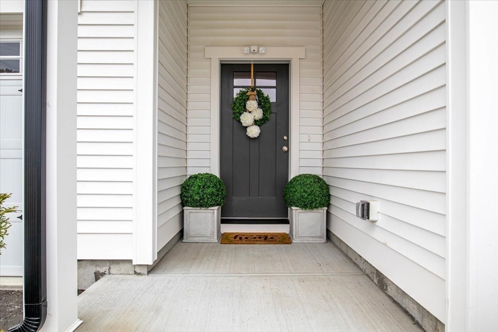 9 Iris Lane Bellingham, MA 02019 - Photo 4 of 34 a view of a entryway in front of house