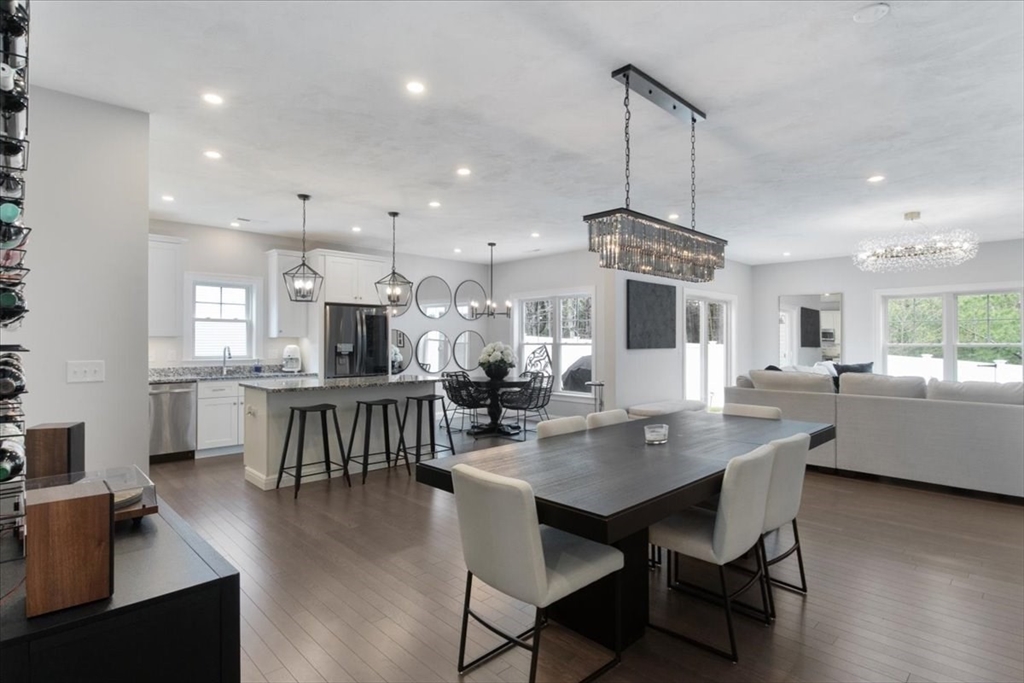 9 Iris Lane Bellingham, MA 02019 - Photo 6 of 34 a dining room with kitchen island stainless steel appliances furniture a dining table and chairs