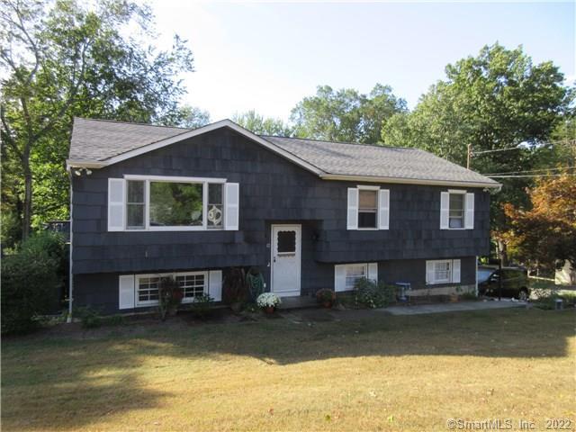 12 Payne Road Bethel, CT 06801 - Photo 1 of 1 a front view of a house with a yard