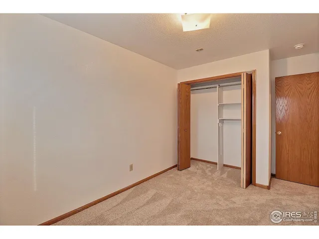 view of an empty room with wooden floor