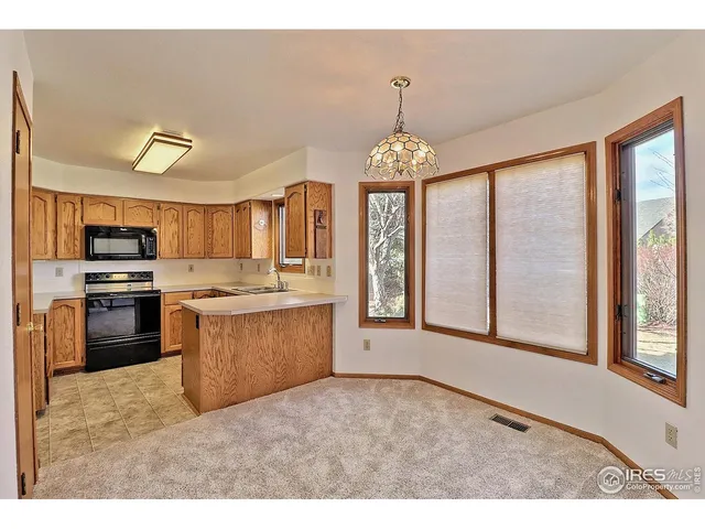 a view of a kitchen with a sink