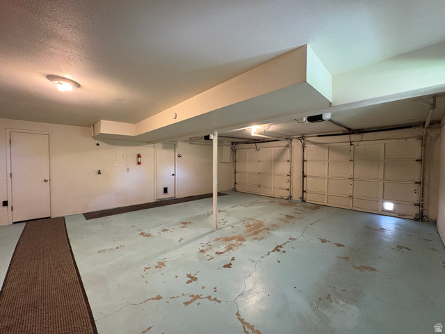 595 Meadowlark Road Orem, UT 84097 - Photo 66 of 87 Spacious two-car garage featuring panel doors and overhead lighting