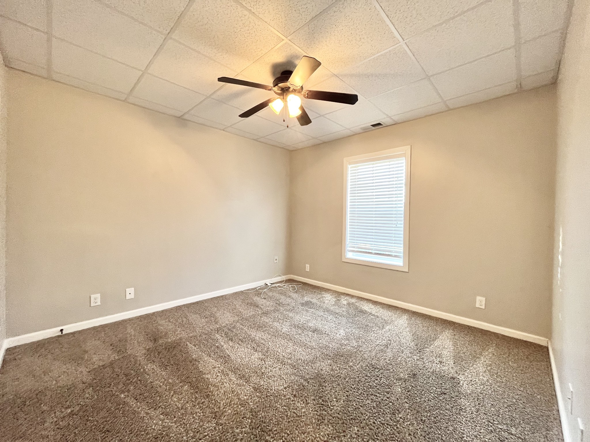 3773 Suiter Road Clarksville, TN 37040 - Photo 18 of 25 an empty room with windows and fan