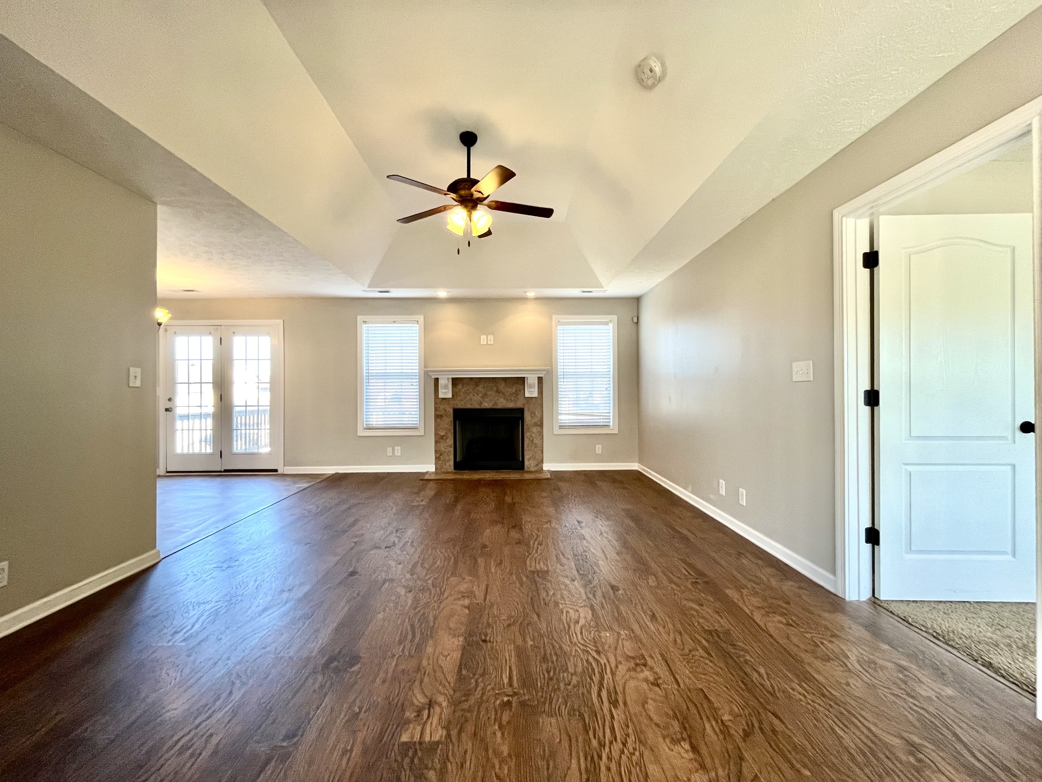 3773 Suiter Road Clarksville, TN 37040 - Photo 2 of 25 a view of empty room with wooden floor and fireplace
