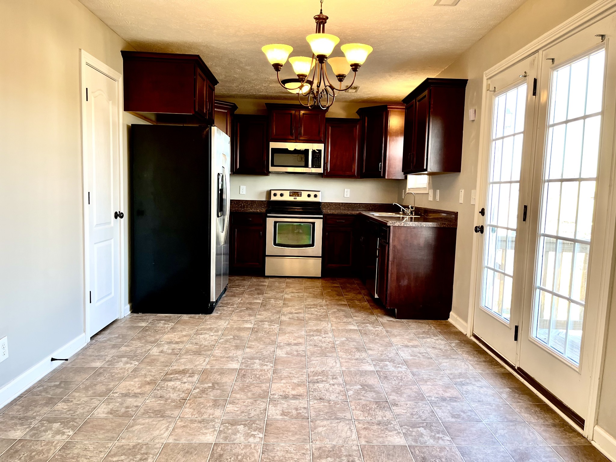 3773 Suiter Road Clarksville, TN 37040 - Photo 4 of 25 a view of a kitchen with stainless steel appliances granite countertop a refrigerator and a stove top oven