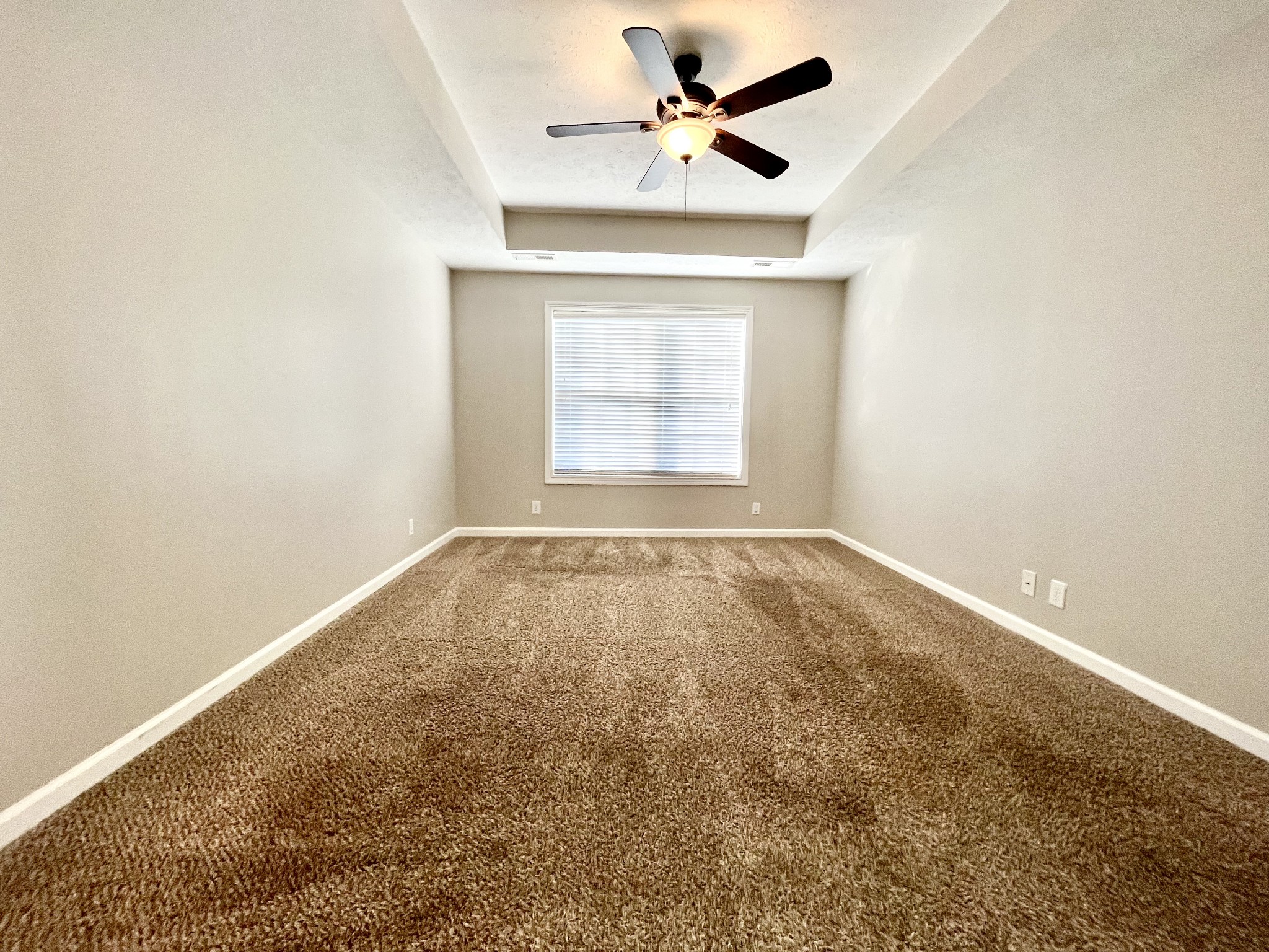 3773 Suiter Road Clarksville, TN 37040 - Photo 7 of 25 an empty room with a window and a ceiling fan