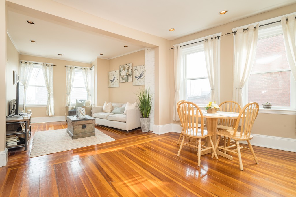 64 Chestnut Street, Unit 3 Boston, MA 02129 - Photo 2 of 9 a living room with furniture and a large window