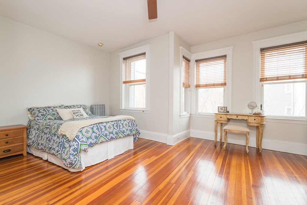 64 Chestnut Street, Unit 3 Boston, MA 02129 - Photo 6 of 9 a living room with a bed and a table chair