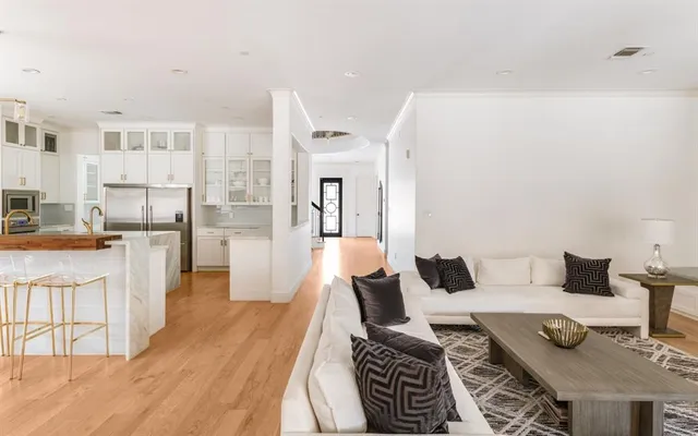 a living room with furniture and a table