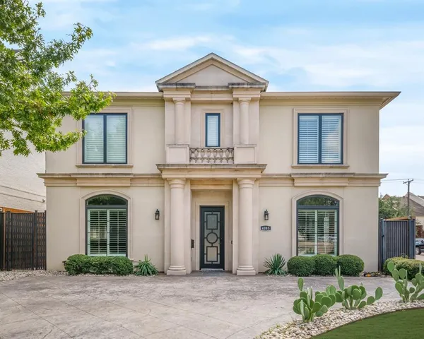 front view of a building with a garden