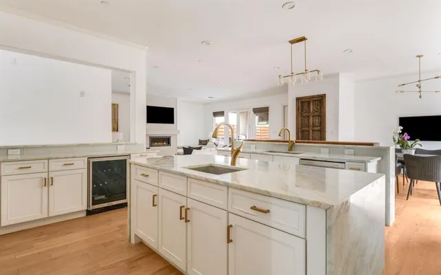a kitchen with stainless steel appliances granite countertop a sink and stove
