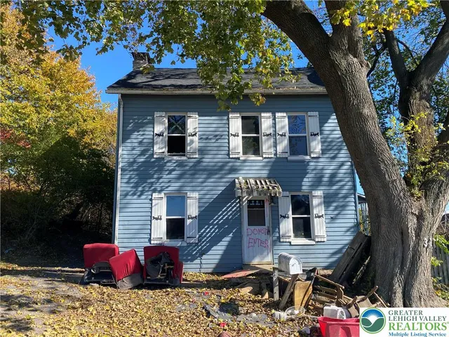 a front view of a house with yard