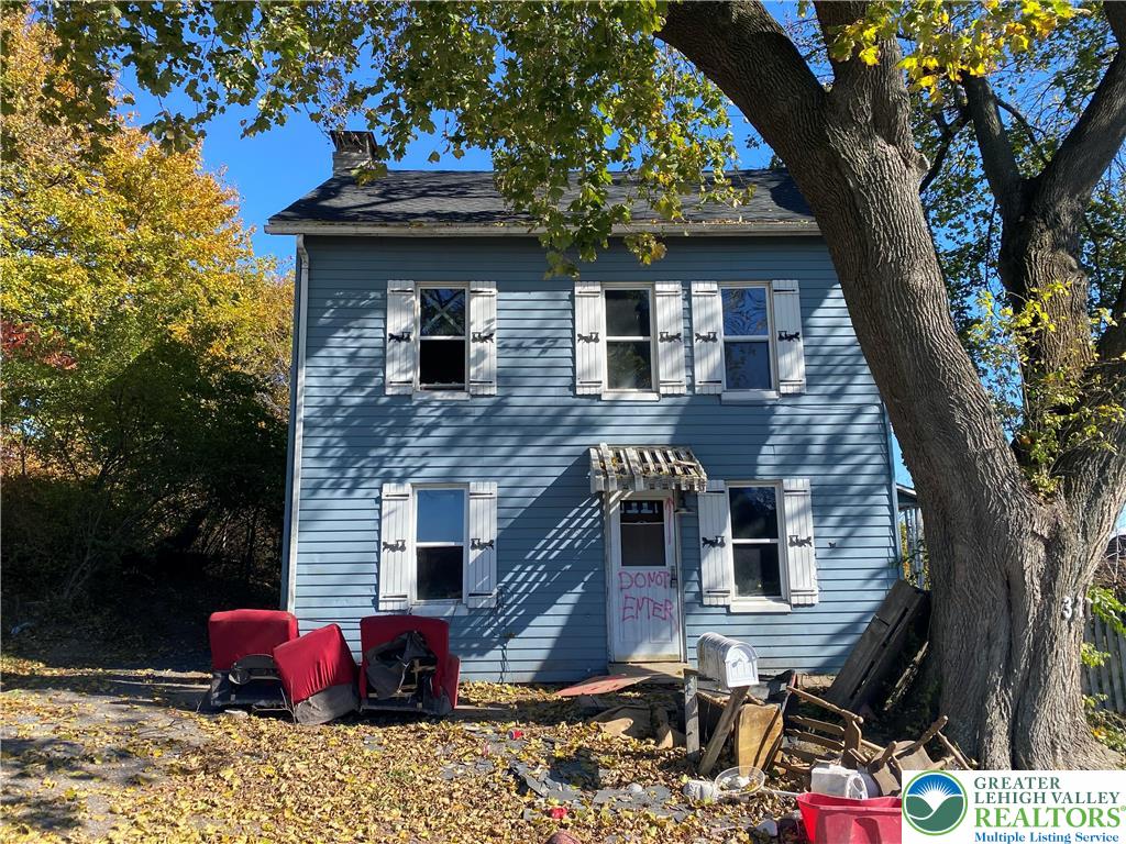 a front view of a house with yard
