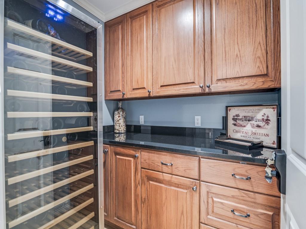 343 East Tripp Road Sunnyvale, TX 75182 - Photo 29 of 36 a kitchen with granite countertop white cabinets and sink